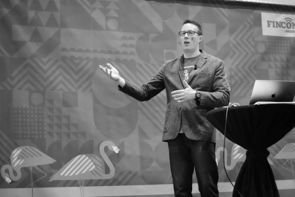 Pete McPherson speaking on stage
